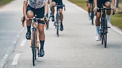 Asian Chinese female cyclist leading in cycling event rural scene
