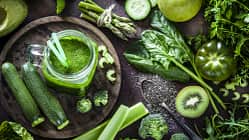 Detox diet concept: green vegetables on rustic table