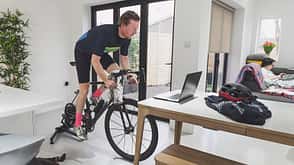 Man cycling on turbo trainer Man cycling on turbo trainer