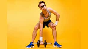 spectacles It's too hard for me! Full length, legs, body, size portrait of youth man look at camera can not lift dumbbells from the floor isolated on vivid yellow background