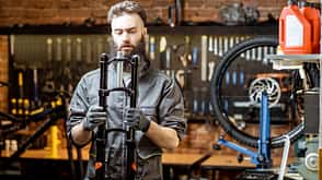 Repairman working in the bicycle workshop
