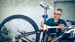 Bicycle mechanic cleaning bicycle Bicycle mechanic cleaning bicycle