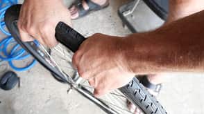 Man mounted bicycle tire close-up Man mounted bicycle tire close-up