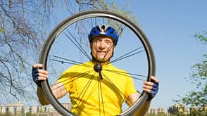 60-65 Years,60s,65-70 Years,Bicycle,Bike Tire,Blue,Caucasian,Cheerful,Clear Sky,Color Image,Cycle,Cycling,Cycling Helmet,Enjoyment,Exercising,Front View,Fun,Happiness,Horizontal,Looking At Camera,Looking Through An Object,Male,Mature Adult,Mature Men,Men,Northern European Descent,One Man Only,One Mature Man Only,One Person,One Senior Man Only,Only Mature Men,Only Men,Only Senior Men,Outdoors,Photography,Racing Bicycle,Senior Adult,Senior Men,Sky,Smiling,Sports Helmet,Spring,Stationary,Toothy Smile,Transparent,Waist Up,blue sky Smiling Senior Looking Through a Bike Tire