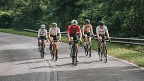 group of asian chinese cyclist training in rural area during weekend morning group of asian chinese cyclist training in rural area during weekend morning
