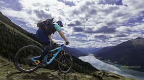 Lake Reschen scenic mountain bike downhill. Lake Reschen scenic mountain bike downhill.