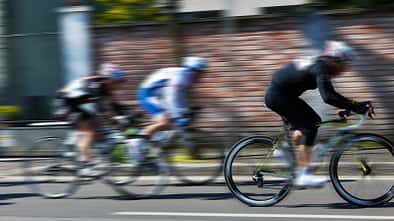 cyclists run on the city street