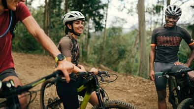 Group of friends cycling together in the nature