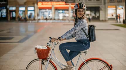 Woman riding a bicycle in city Woman riding a bicycle in city