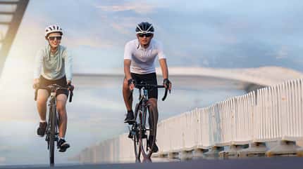 20-25 years,asian,bridge,china,chinese,couple,dual carriage ways,oriental,urban scene Young couples in the outdoor cycling