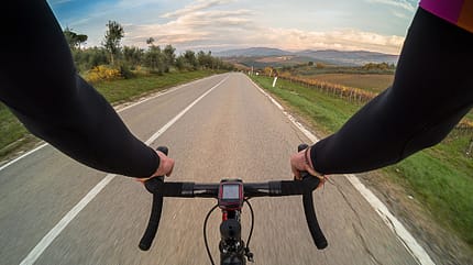 Racing Bicycle,Sports Race,Non-Urban Scene,Physical Activity,Men,Personal Perspective,Cycle,Sports Training,Handlebar,Cypress Tree,Riding,Asphalt,Exercising,Healthy Lifestyle,Vineyard,One Person,Action,Speed,Motion,Concepts,Sport,Nature,Outdoors,Blurred Motion,Competitive Sport,Cycling,Human Hand,Human Arm,People,Tuscany,Italy,Europe,Tree,Sunset,Autumn,Sky,Street,Road,Equipment,Bicycle,Tuscan Countryside Enjoying autumn season in beautiful Tuscany on a racing bike