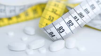 Fat,Pill,Dieting,Meal,Weight,Centimeter,Antibiotic,Hungry,Fast Food Restaurant,Measuring,Loss,Yellow,Overweight,Healthcare And Medicine,The Human Body,Slim,Tape Measure,Instrument of Measurement,Dinner,Food,Body Mass Dieting pills
