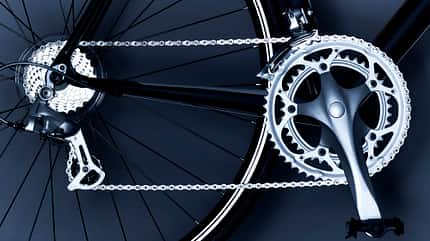 bicycle,bicycle chain,bicycle gear,bicycle wheel,black and white,chain,close up,cog,detail,horizontal,link,metal,no people,pedal,photography,spoke,studio shot,transportation,wheel Close up of bicycle chain, pedal and gears