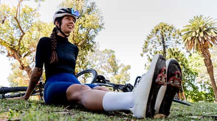 Cyclist taking a break in urban park