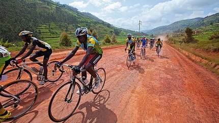Bicycle,Color Image,Colour Image,Competition,Country Road,Cycle,Cycling,Day,Endurance,Following,Horizontal,Non-Urban Scene,Outdoors,Photography,Professional Athlete,Professional Sport,Riding,Road Cycling,Speed,Sport,Sports Clothing,Sports Race,Sports Uniform Cycling - Tour Of Rwanda