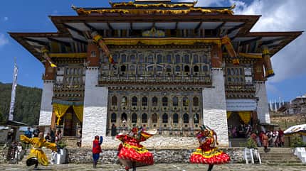 ura lhakhang,sacred,yakchoe festival,buthan,buddhist,masks,adults,bhutan-2024-618,dance,temple,unrecognizable people,mask,bhutanese,mythical creature,colour image,tourist destinations,public celebratory event Mask dancers at the annual Ura Yakchoe festival, Bumthang, Ura, Bhutan