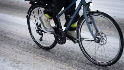 Bicycle driving on snowed street