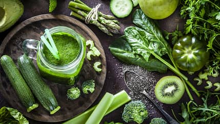 Detox diet concept: green vegetables on rustic table