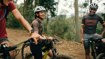 Group of friends cycling together in the nature