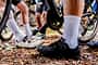 Low section of cyclists preparing for ride on autumn trail Low section of cyclists preparing for ride on autumn trail