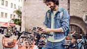 Young tourist renting an e-bike to explore Barcelona