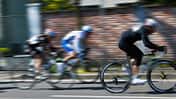 cyclists run on the city street