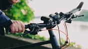 Young man with bike using smartphone