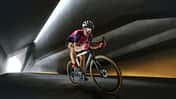 Portrait of man, professional cyclist training, riding on professional sport bike around city on tunnel in a daytime