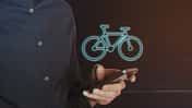 Young Business Man Using Smartphone with Bicycle Icon